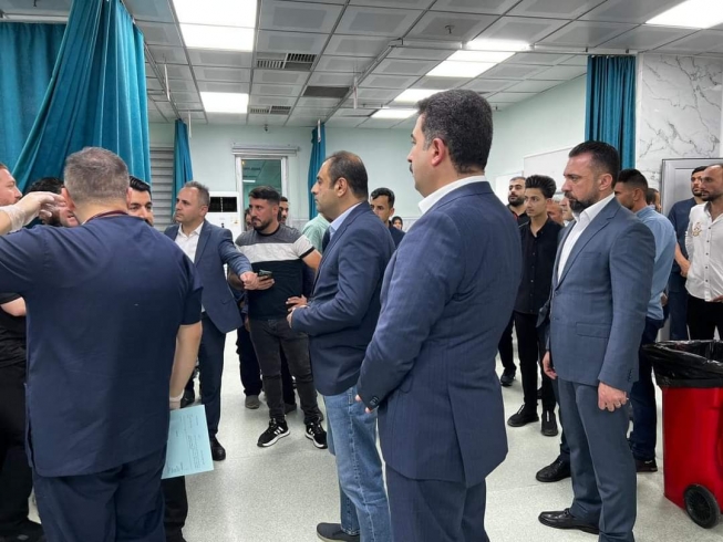 پارێزگاری هەولێر بە وەکالەت، بریندارەکانی کارەساتی لافاوی کۆڕێ بەسەر دەکاتەوە