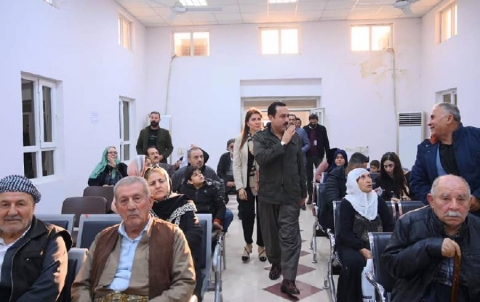  In Erbil.  The process of distributing bank cheques to compensate victims of the Ba'ath regime continues