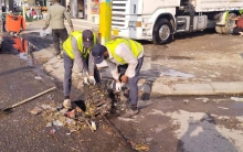 Cleaning the manholes from waste and garbage by the workers and teams of Municipality 3