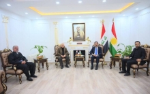  The governor of Erbil discusses the original work of Kurdish art with the head and members of the Bawaji music band of Koya